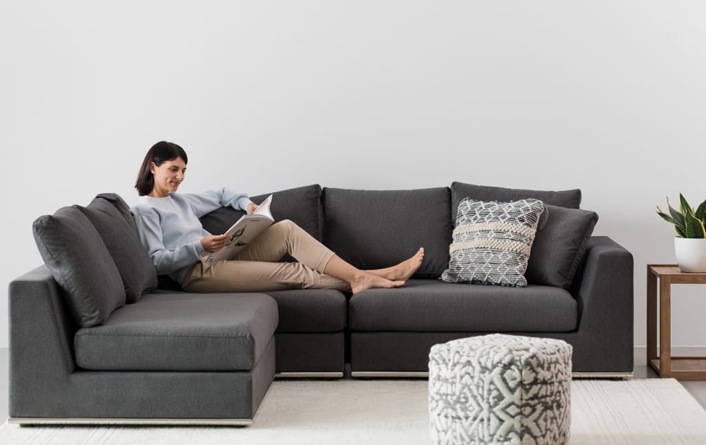 Flow sectional sofa in charcoal in room
